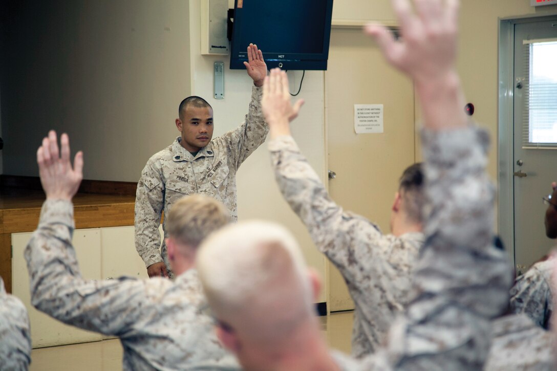 Staff Sgt. Duane C. Pineda speaks with junior Marines at 3rd Medical Battalion’s Lance Corporals’ Symposium Oct. 30 at the Chapel Center on Camp Foster. The three-day symposium was developed by staff noncommissioned officers within 3rd Med. Bn. to help lance corporals and privates first class develop their leadership styles in preparation for the next rank as well as introducing them to the NCO mindset. Pineda is a water support technician with 3rd Med. Bn., 3rd Marine Logistics Group, III Marine Expeditionary Force. 