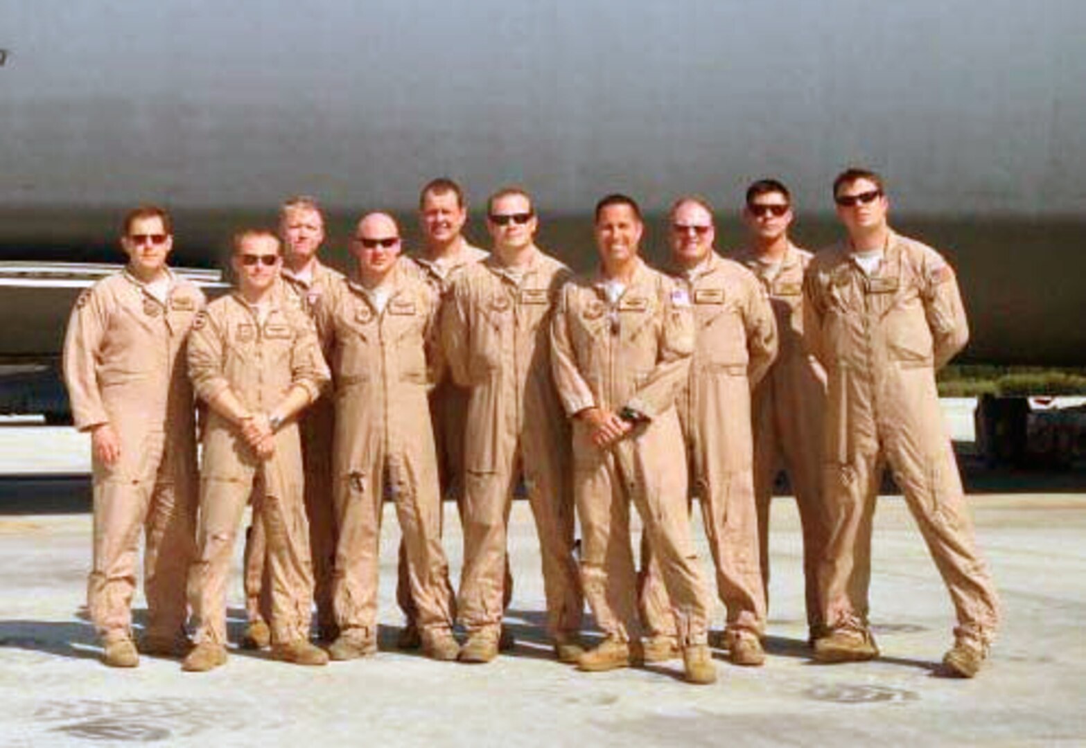 Crew members who received the 2013 Earl T. Ricks award pose in front of a C-5 Galaxy April 19, 2013. During an overseas mission the aircraft struck multiple birds during takeoff. Two engines were damaged but the crew managed to return the aircraft safely to the airfield.