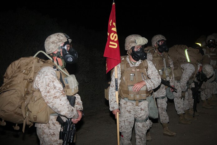 Marines with Combat Logistics Battalion 15, Combat Logistics Regiment 17, 1st Marine Logistics Group, reach the summit of a hill during a combat conditioning exercise aboard Camp Pendleton, Calif., Oct. 31, 2013. Marines undergo conditioning exercises, such as hiking, to build physical endurance and camaraderie within the battalion and set Marines up for success if they are faced with situations requiring physical courage.