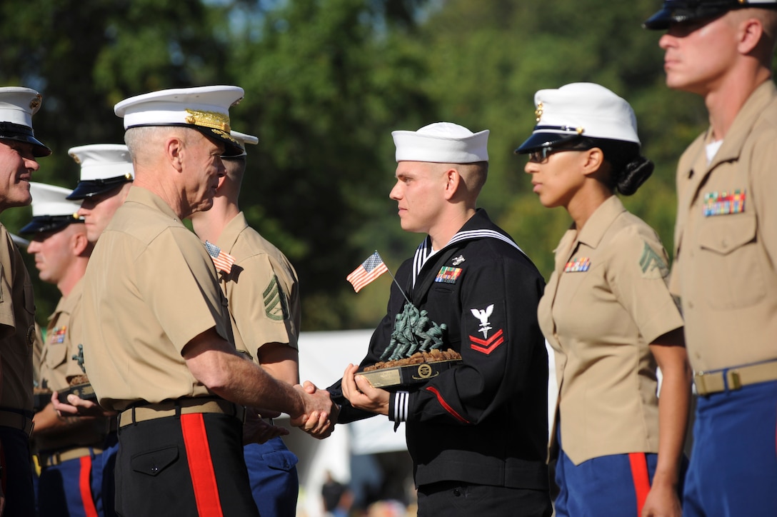 Petty Officer 2nd Class Jamie C. Harris, a hospital corpsman with 2nd Tank Battalion, 2nd Marine Division, from Knoxville, Tenn., receives the Chief Hospital Corpsman George William “Doc” Piercy award at the Marine Corps League Enlisted Awards, Sept. 25, 2013, from Gen. James F. Amos, the Commandant of the Marine Corps, aboard Marine Corps Base Quantico, Va. Harris was awarded for increasing combat readiness in a medical support element within the Fleet Marine Force. 