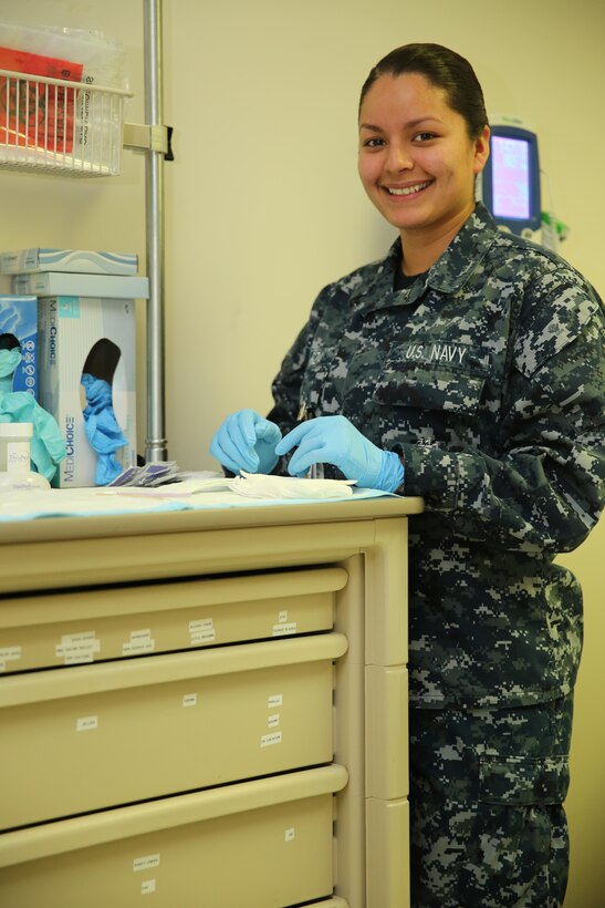 Seaman Leticia Garza works as a hospitalmen for the Naval Health Clinic. Garza works in the Woman's Health Clinic and makes sure that all women are in good health in order to deploy. 