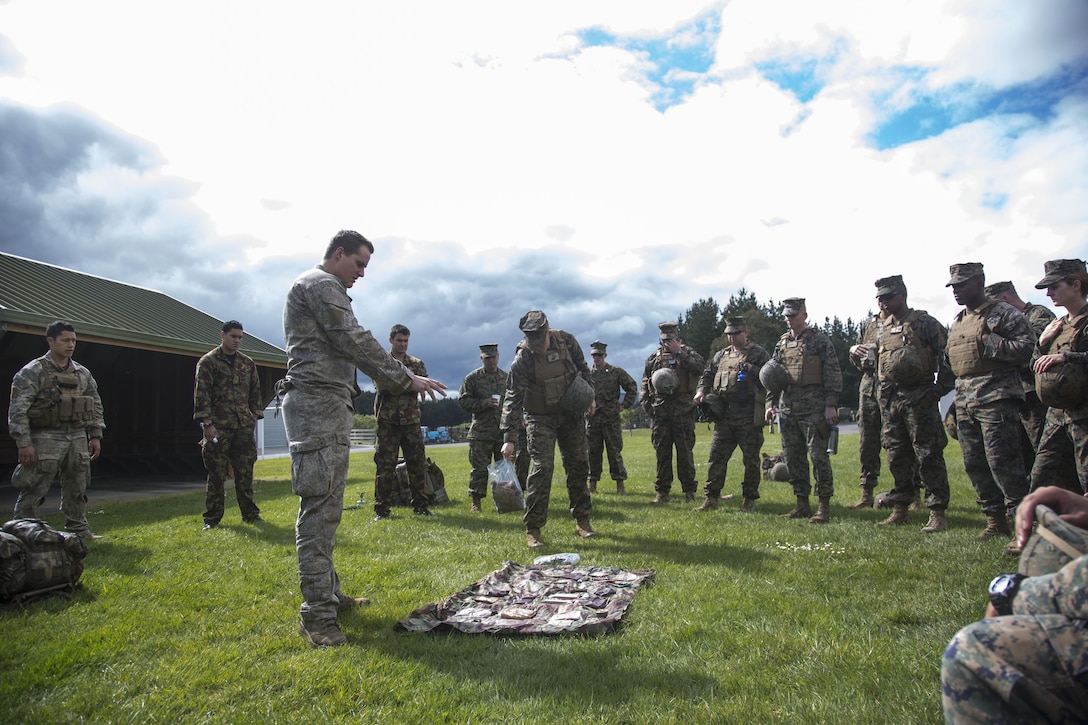 New Zealand Army Cpl. Tango Anderson, left center, a reconnaissance detachment commander with 1st Royal New Zealand Infantry Regiment, briefs U.S. Marines on the New Zealand Operational Ration Pack during familiarization training in preparation for exercise Southern Katipo (SK13), on Linton Military Camp, Linton, New Zealand, Nov. 4. SK13 is a New Zealand led training exercise to enhance interoperability between coalition forces and to help the New Zealand Defence
Force further develop their amphibious capabilities.(U.S. Marine Corps photo by Cpl. Luis A. Vega 1st Marine Division Combat Camera/Released)