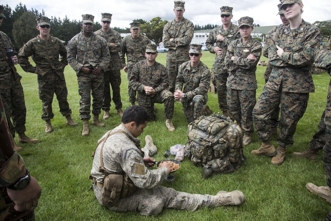 New Zealand Army Pvt. Richard McLaree, lower center, a reconnaissance patrol member with 1st Royal New Zealand Infantry Regiment, teaches U.S. Marines about the Operational Ration Pack during familiarization training in preparation for exercise Southern Katipo 2013 (SK13), on Linton Military Camp, Linton, New Zealand, Nov. 4, 2013. SK13 is a New Zealand led training exercise to enhance interoperability between coalition forces and to help the New Zealand Defence Force further develop their amphibious capabilities. (U.S. Marine Corps photo by Cpl. Luis A. Vega 1st Marine  Division Combat Camera/Released)