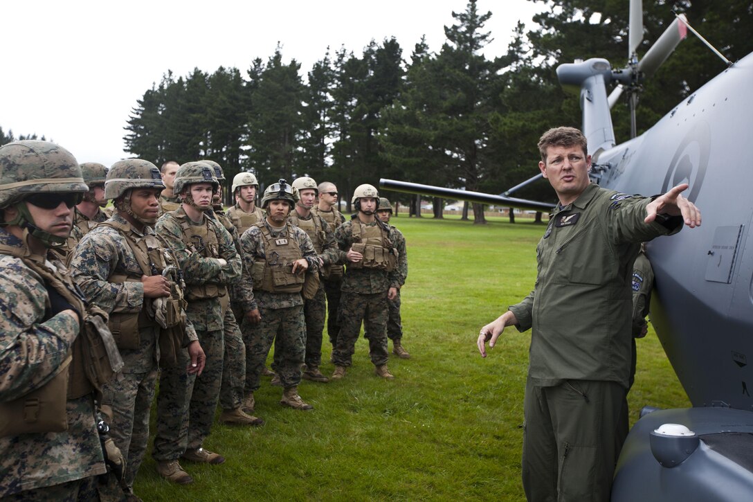 Sgt. Ben Fraser, helicopter crewman with Helicopter Transition Unit NH-90, from Timaru, New Zealand, instructs Marines during a helicopter familiarization brief given during the initial stages of exercise Southern Katipo 2013 at Linton Military Camp in Linton, New Zealand, Nov. 4. The purpose of SK13 increases the ability of all participants to coordinate in complex operations.