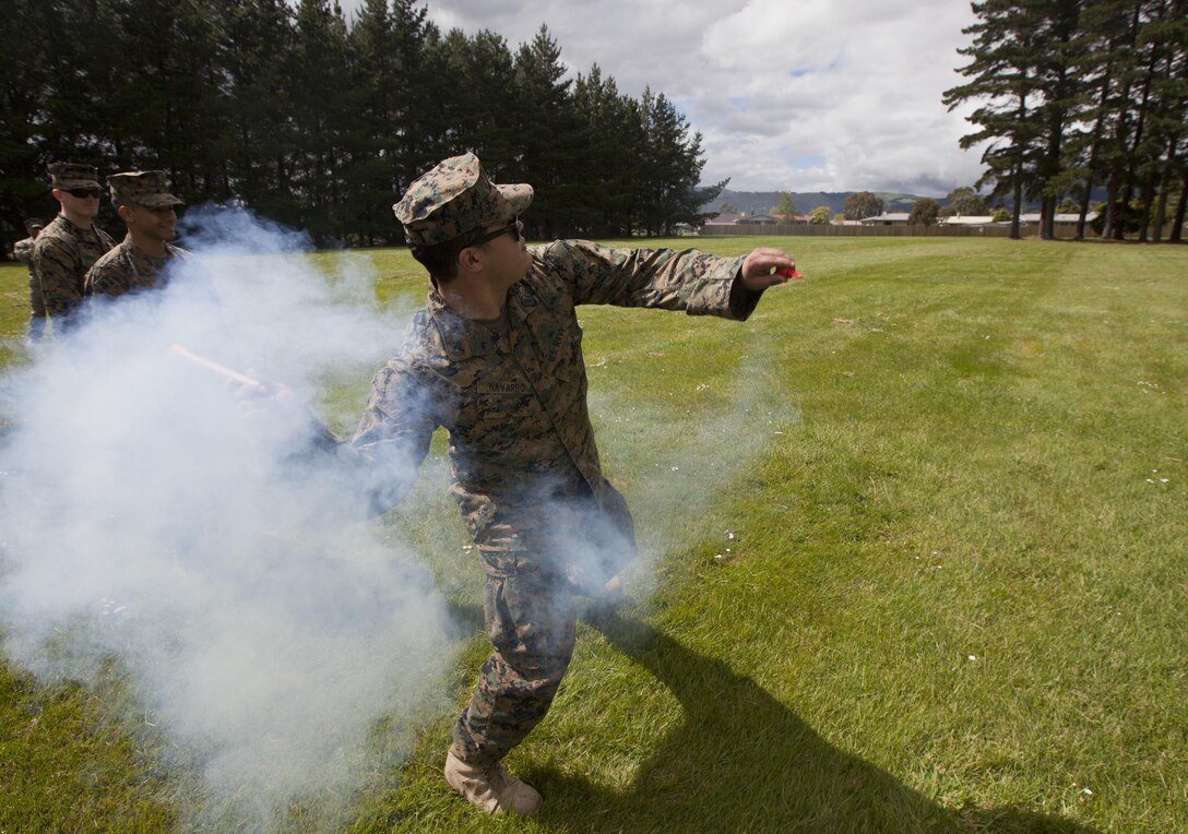 Petty Officer 3rd Class Josue Navarro, a hospital corpsman with 1st Marine Logistics Group, from McAllen, Texas, throws a training grenade during the initial stages of exercise Southern Katipo 2013 at Linton Military Camp in Linton, New Zealand, Nov. 4. The purpose of SK13 strengthens military to military relationships and cooperation with partner nations and the New Zealand Defence Force.  