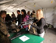 Husbands and wives of Marines with 2nd Supply Battalion, Combat Logistics Regiment 25, 2nd Marine Logistics Group got hands-on with numerous weapons during a Jane Wayne Day held aboard Camp Lejeune, N.C., Nov. 7, 2013. The day’s events gave spouses a first-hand look at how their loved ones train. (U,S, Marine Corps photo by Lance Cpl. Shawn Valosin)