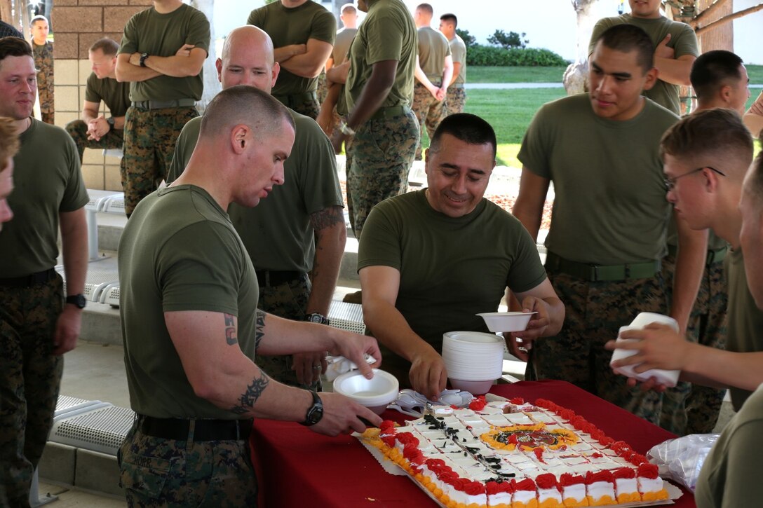 First Marine Expeditionary Force (Forward) Marines enjoy birthday cake in celebration of the 238th Marine Corps Birthday aboard Camp Pendleton, Calif., Nov. 7, 2013. The command, which is scheduled to deploy to Helmand province, Afghanistan, during early 2014, took time out of their predeployment training to celebrate the Marine Corps' upcoming birthday by conducting a motivational run and a cake-cutting ceremony.