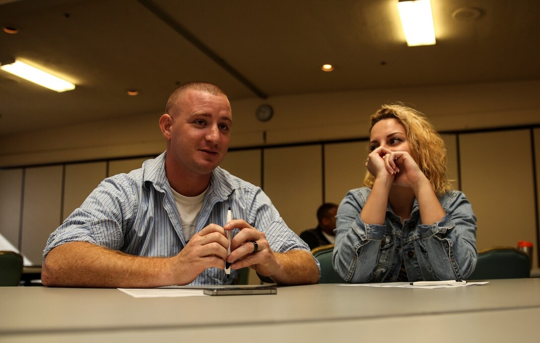 Sergeant Justin Maggard, logistics management coordinator, 15th Marine Expeditionary Unit, talks with his wife Lindsey during the Four Lenses communication class at the Family Readiness Center aboard Camp Pendleton, Calif., Nov. 5 The class is designed to enhance personal and working relationships and individuals learn about their personality. (U.S. Marine Corps Photo by Cpl. Emmanuel Ramos/Released)