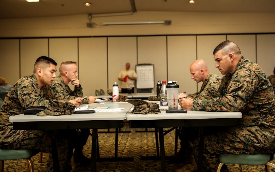 Marines with the 15th Marine Expeditionary Unit answer questions about their values, joys, strengths and needs during the Four Lenses communications class at the Family Readiness Center aboard Camp Pendleton, Calif., Nov. 5. The class is designed to enhance personal and working relationships and individuals learn about their personality. (U.S. Marine Corps Photo by Cpl. Emmanuel Ramos/Released)