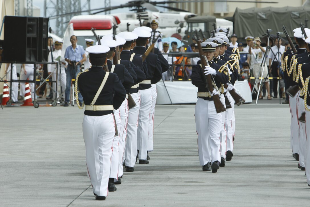 The Japanese Marintime Self-Defense Force Fleet Air Wing 31 drill platoon performs rifle manual techniques during a demonstration at the JMSDF Iwakuni Air Base Festival here Sunday. There are approximately 1,600 JMSDF service members on station here.