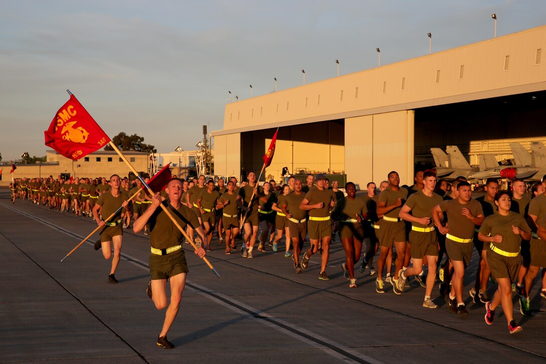 Marines participate in the Marine Corps 238th birthday run during a brisk morning at the flight line aboard Marine Corps Air Station Miramar, Calif., Nov. 7. Marines held a cake cutting ceremony the same day, recognizing the passing of wisdom from the oldest and youngest Marine.