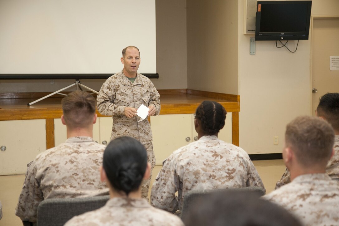 Col. Mark M. Walter discusses leadership at 3rd Medical Battalion's Lance Corporals' Symposium Oct. 30 at the Chapel Center on Camp Foster. The three-day symposium was developed by staff noncommissioned officers within 3rd Med. Bn. to help lance corporals and privates first class develop their leadership styles in preparation for the next rank as well as introducing them to the NCO mindset. Walter is the chief of staff for 3rd Marine Logistics Group, III Marine Expeditionary Force (U.S. Marine Corps photo by Lance Cpl. Natalie M. Rostran/ Released)