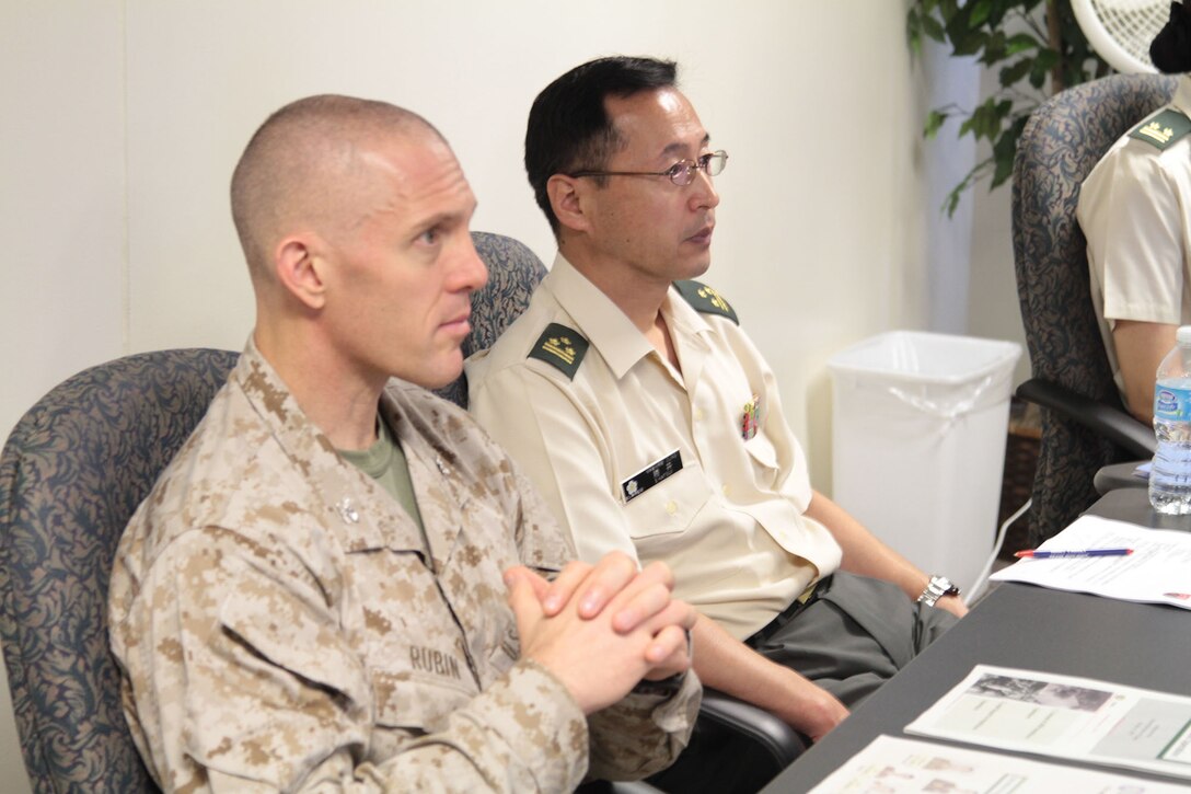 Col. Peter S. Rubin and Japan Ground Self-Defense Force Col. Shoji Katsui attend a bilateral training conference to discuss legal issues and requirements for judge advocates in relation to amphibious operations and other subjects Oct. 31 at the Westpac Lodge conference room at Camp Foster. "Today, we are helping the Japan Ground Self-Defense Force understand the vital role judge advocates play in amphibious operations," said Rubin. "After today, they will be able to better recognize and resolve issues that they will encounter in the operational context." Rubin is the staff judge advocate for Marine Corps Installations Pacific. Katsui is the deputy staff judge advocate for the JGSDF. (U.S. Marine Corps photo by Lance Cpl. Stephen D. Himes/Released)