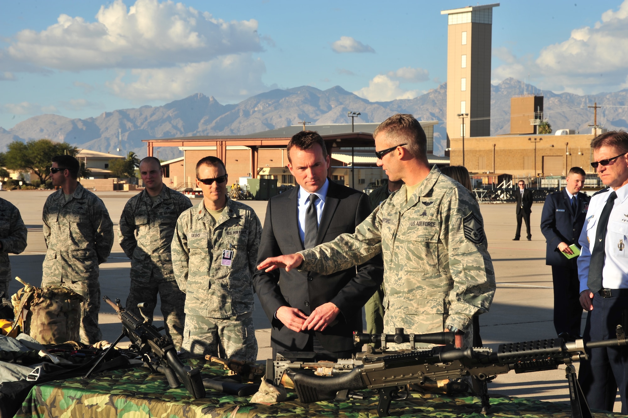 Acting Secretary of the Air Force Eric Fanning looks at different weapons used by Airmen assigned to the base during a familiarization tour at Davis-Monthan Air Force Base, Ariz., Nov. 5, 2013. Fanning is visiting Air Force installations to learn about their mission capabilities and to address key issues affecting the future of the Air Force. (U.S. Air Force photo/SrA Joshua Slavin)(Released)