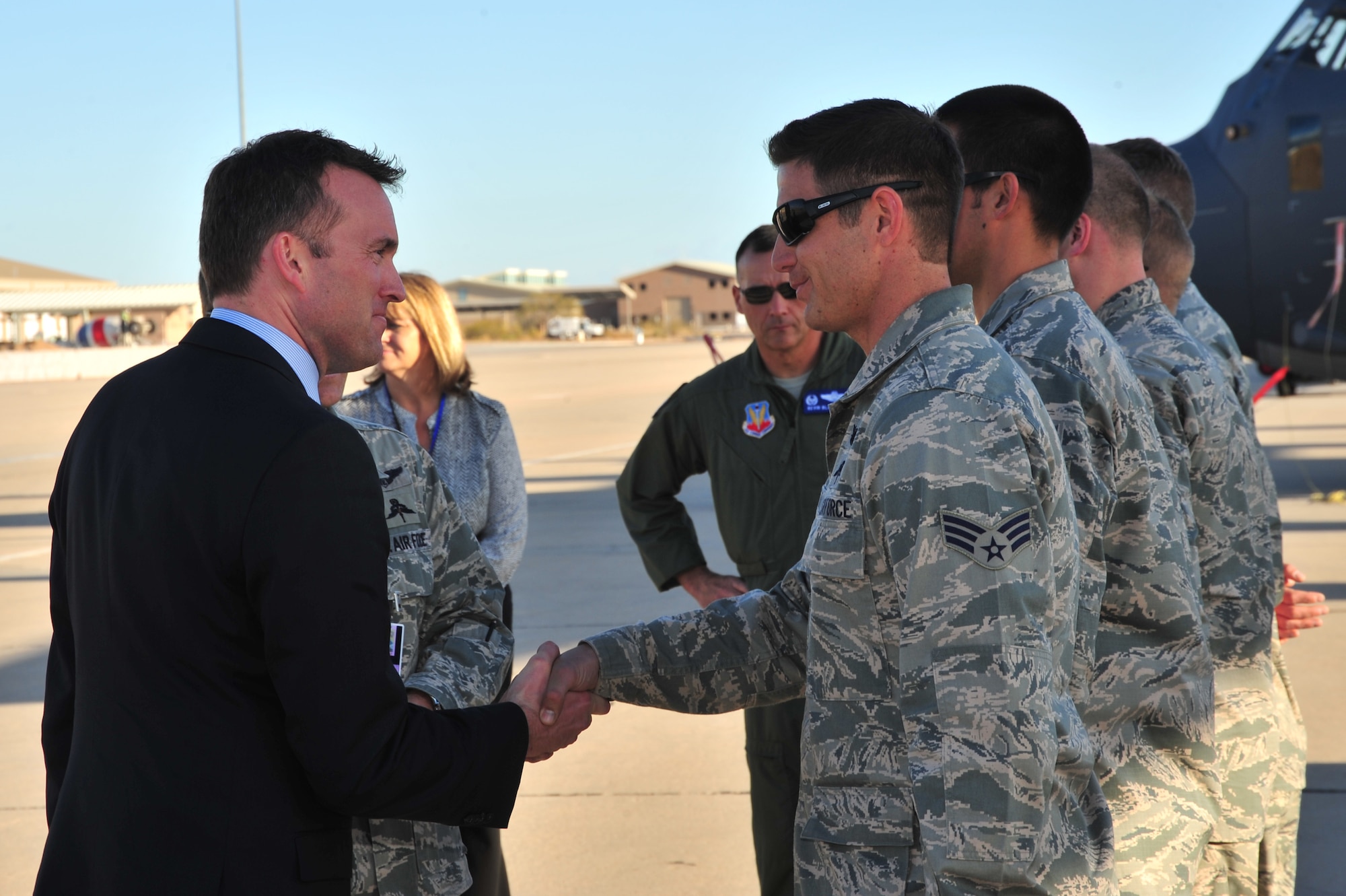 Acting Secretary of the Air Force Eric Fanning shakes hands with Senior Airman Jason Mead, 48th Rescue Squadron pararescueman, during a familiarization tour at Davis-Monthan Air Force Base, Ariz., Nov. 5, 2013. Fanning is visiting Air Force installations to learn about their mission capabilities and to address key issues affecting the future of the Air Force. (U.S. Air Force photo/SrA Joshua Slavin)(Released) (Cropped)