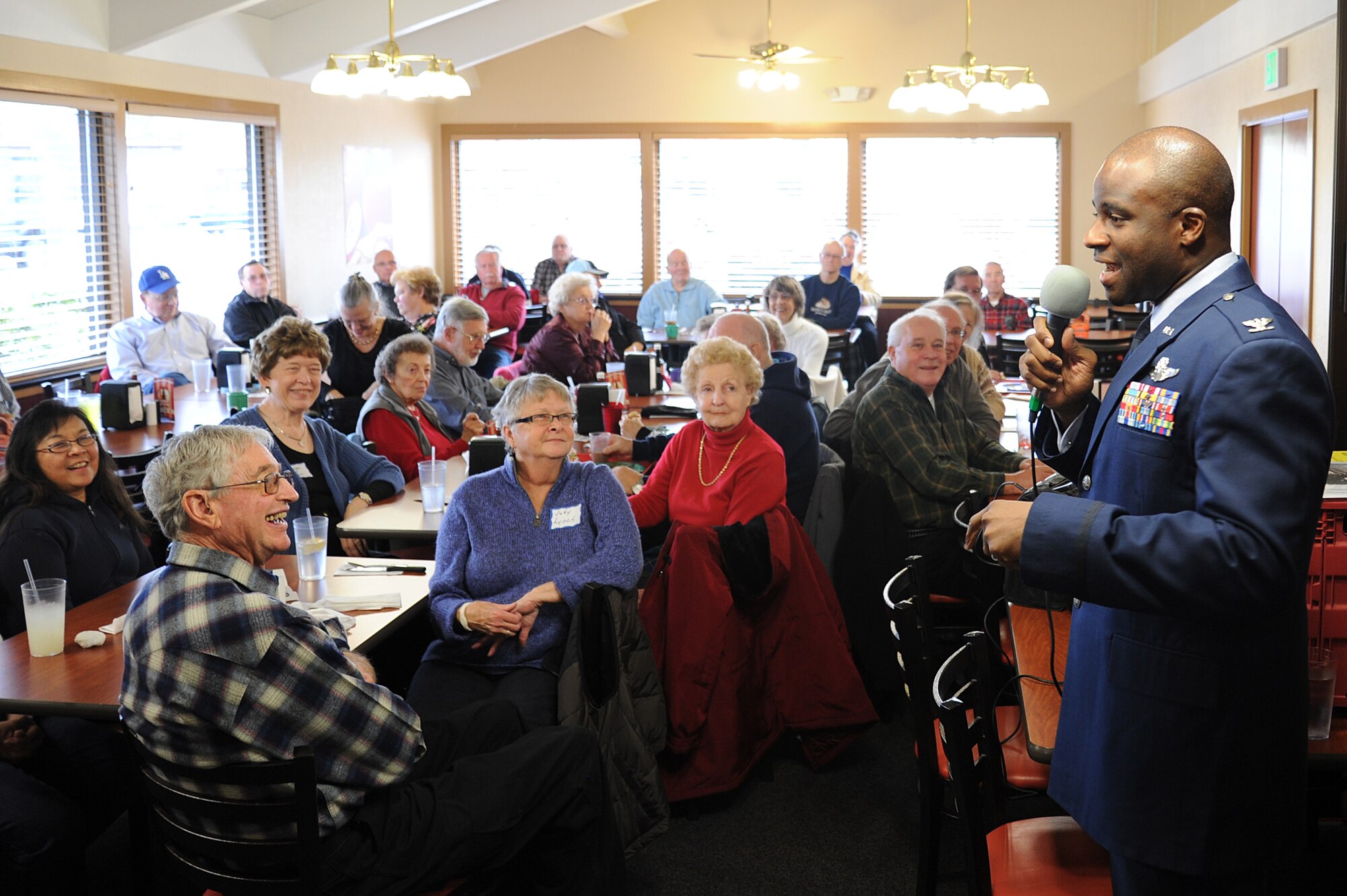 Col. Brian Hill, 92nd Air Refueling Wing vice commander, speaks with the Association of Retired Avista Employees at a restaurant downtown Nov. 7, 2013. Hill recognized veterans in attendance and gave a Fairchild mission brief informing them about all current operations and the importance of Fairchild Airmen in maintaining mission readiness. (U.S. Air Force photo by Airman 1st Class Janelle Patiño/Released)