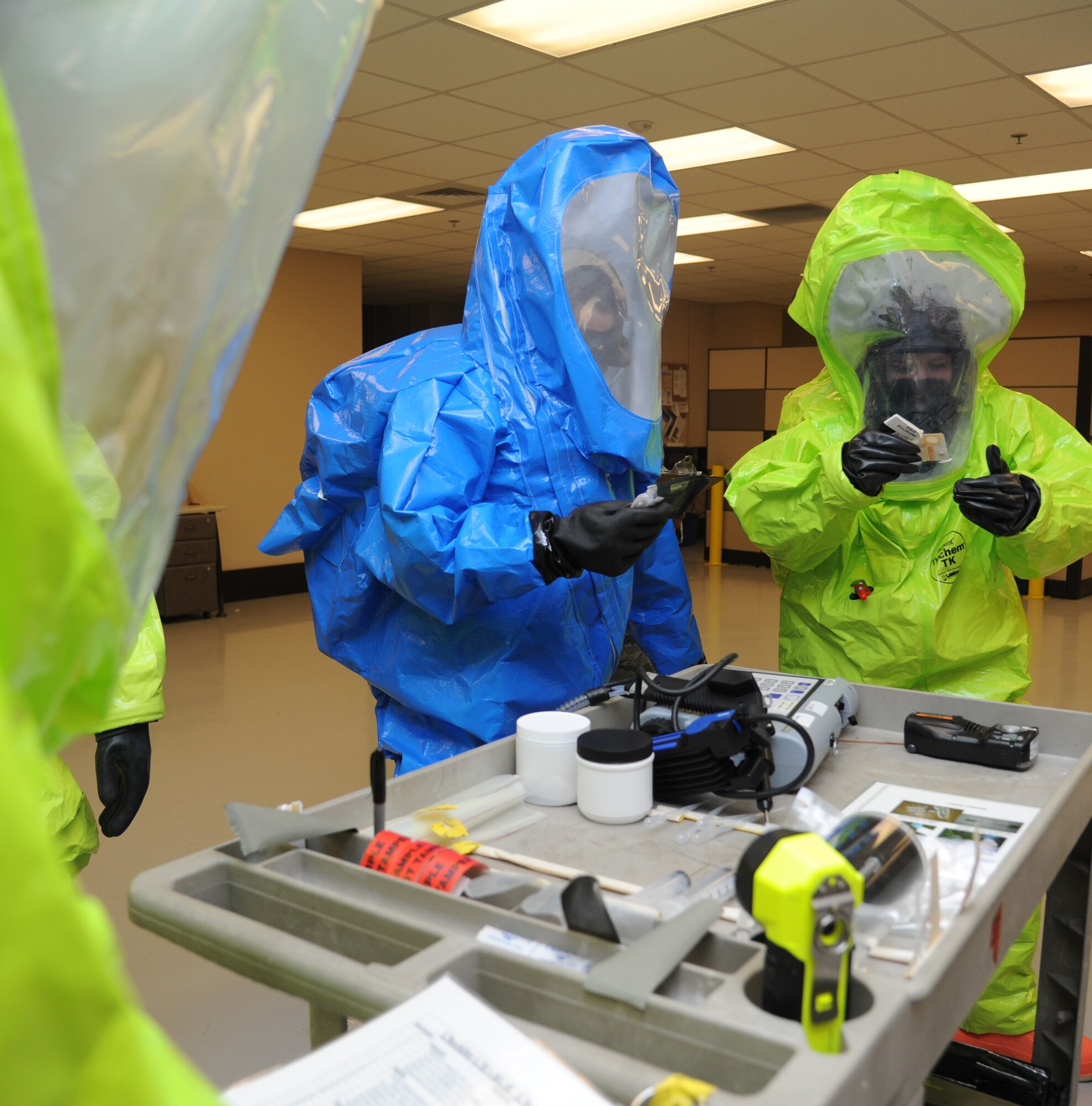 Airman 1st Class Von Fernan Carios, 81st Aerospace Medicine Squadron bioenvironmental engineering technician, and Kristina Kilpatrick, Emergency Management contractor, use a chemical agent detector kit to help identify hazardous vapors in the air during a Chemical, Biological, Radiological, Nuclear, and high-yield Explosive exercise scenario Nov. 6, 2013, at Keesler Air Force Base, Miss.  The Force Protection Condition exercise scenario included a suspect posing as a driver making a delivery to the Locker House and spraying a chemical on a group of Airmen as they were assisting him with unloading the packages from the truck.  Immediately, the Airmen simulated receiving eye irritations, excessive sweating, chest pain, choking, and vomiting from exposure to the chemical.  (U.S. Air Force photo by Kemberly Groue)