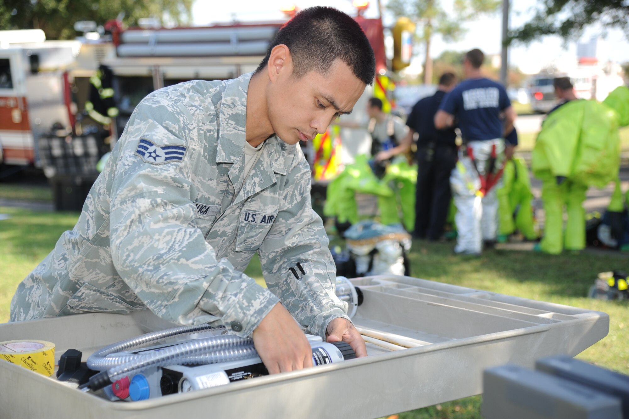 Senior Airman Paul Calica, 81st Aerospace Medicine Squadron bioenvironmental engineering technician, prepares the thermo-scientific TVA-1000 flame ionization detector to quickly identify inorganic and organic toxic vapors within the contamination zone during a Chemical, Biological, Radiological, Nuclear, and high-yield Explosive exercise scenario Nov. 6, 2013, at Keesler Air Force Base, Miss.  The Force Protection Condition exercise scenario included a suspect posing as a driver making a delivery to the Locker House and spraying a chemical on a group of Airmen as they were assisting him with unloading the packages from the truck.  Immediately, the Airmen simulated receiving eye irritations, excessive sweating, chest pain, choking, and vomiting from exposure to the chemical. (U.S. Air Force photo by Kemberly Groue)