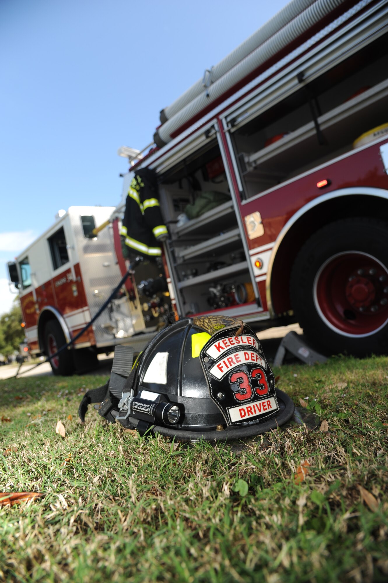 The Keesler Fire Department arrives on site during a Chemical, Biological, Radiological, Nuclear, and high-yield Explosive exercise scenario to assemble HAZMAT equipment for decontamination Nov. 6, 2013, at Keesler Air Force Base, Miss.  The Force Protection Condition exercise scenario included a suspect posing as a driver making a delivery to the Locker House and spraying a chemical on a group of Airmen as they were assisting him with unloading the packages from the truck.  Immediately, the Airmen simulated receiving eye irritations, excessive sweating, chest pain, choking, and vomiting from exposure to the chemical. (U.S. Air Force photo by Kemberly Groue)