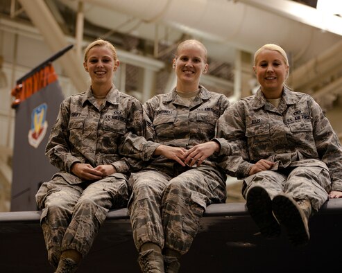 Airman 1st Class Gabrielle Swift, Airman 1st Class Rachel Burchnell and Senior Airman Jamie Ellis, 366th Operations Support Squadron Airmen, gather in a maintenance hangar at Mountain Home Air Force Base, Idaho, Nov. 7, 2013, and reflect on intervening and preventing a potential sexual assault at a Boise State University football game in October. The Air Force has no tolerance for sexual assault and the Airmen used their training and Wingman concept to assist a college student who could have potential fallen victim to the crime. (U.S. Air Force photo by Master Sgt. Kevin Wallace/RELEASED)