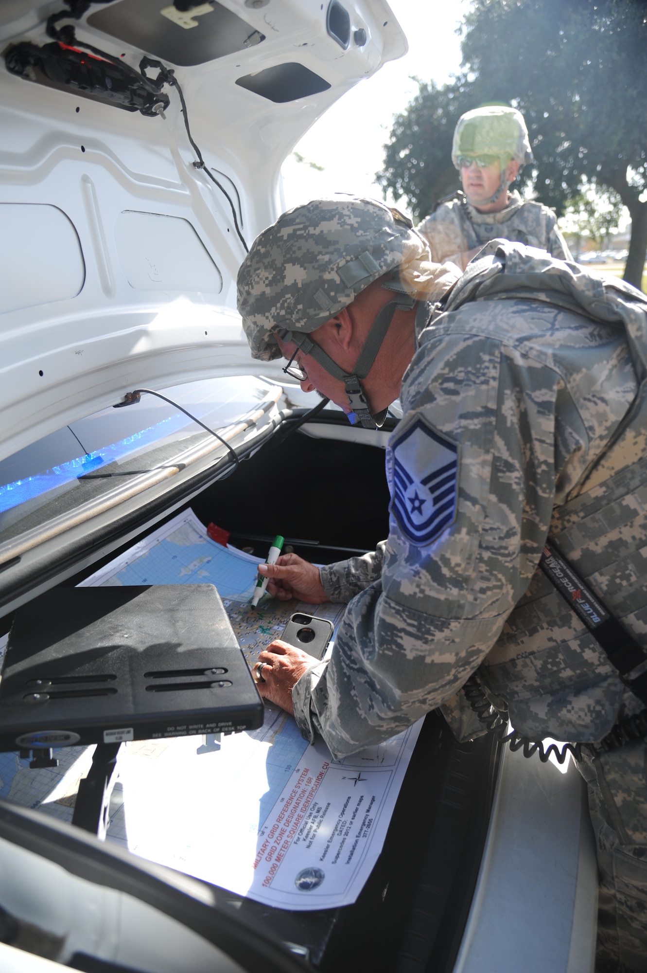 Master Sgt. Grant Michael, 81st Security Forces Squadron, determines  the cordon area during a Chemical, Biological, Radiological, Nuclear, and high-yield Explosive exercise scenario Nov. 6, 2013, at Keesler Air Force Base, Miss.  The Force Protection Condition exercise scenario included a suspect posing as a driver making a delivery to the Locker House and spraying a chemical on a group of Airmen as they were assisting him with unloading the packages from the truck.  Immediately, the Airmen simulated receiving eye irritations, excessive sweating, chest pain, choking, and vomiting from exposure to the chemical.  (U.S. Air Force photo by Kemberly Groue)