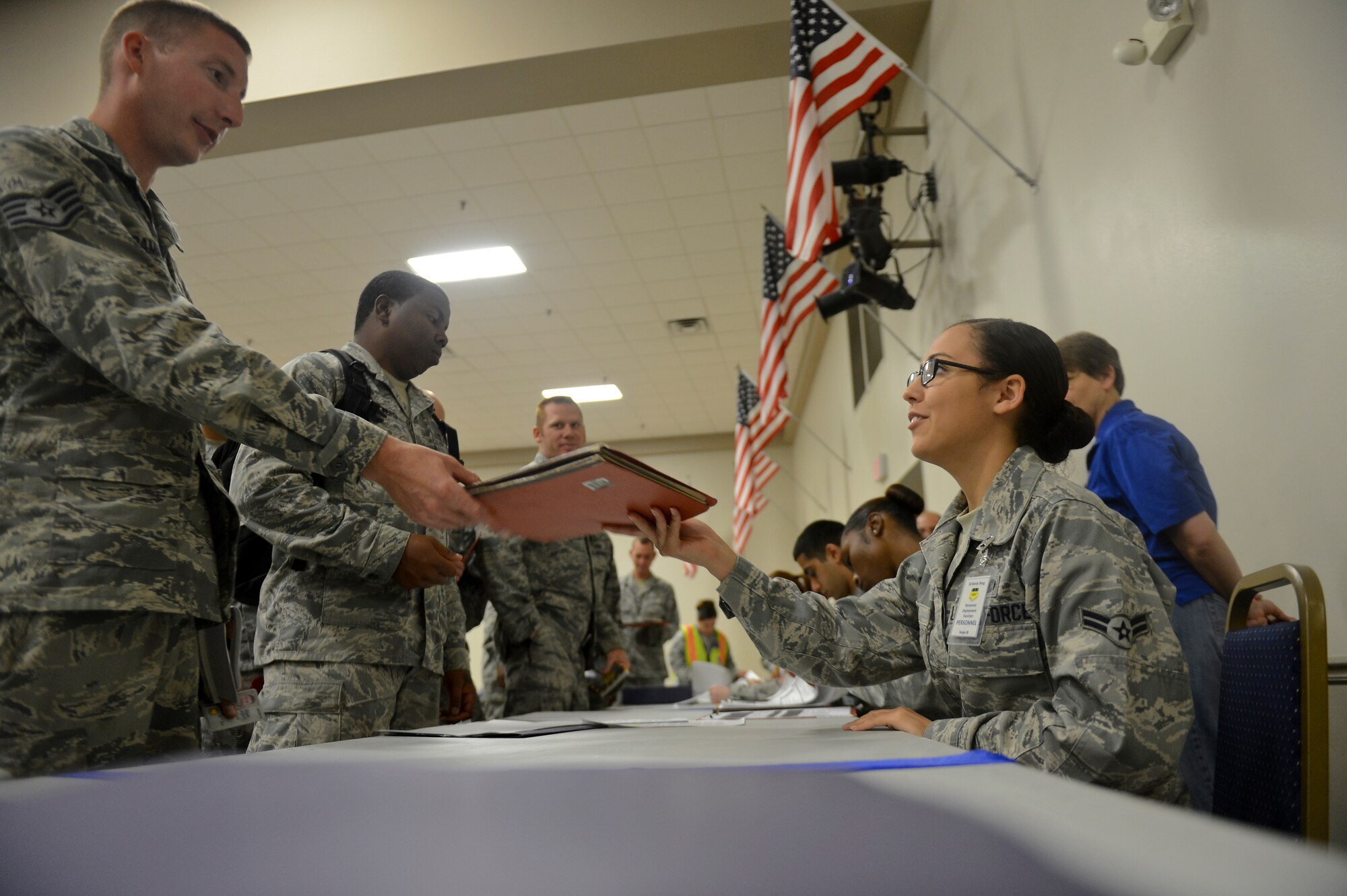 Airmen from the 2nd Logistics Readiness Squadron and 2nd Security Forces Squadron process through a deployment line on Barksdale Air Force Base, La., Oct. 29, 2013. Before deploying, Airmen must make their way through a deployment line to ensure they have all of their affairs in order before departing. (U.S. Air Force photo/Senior Airman Micaiah Anthony)