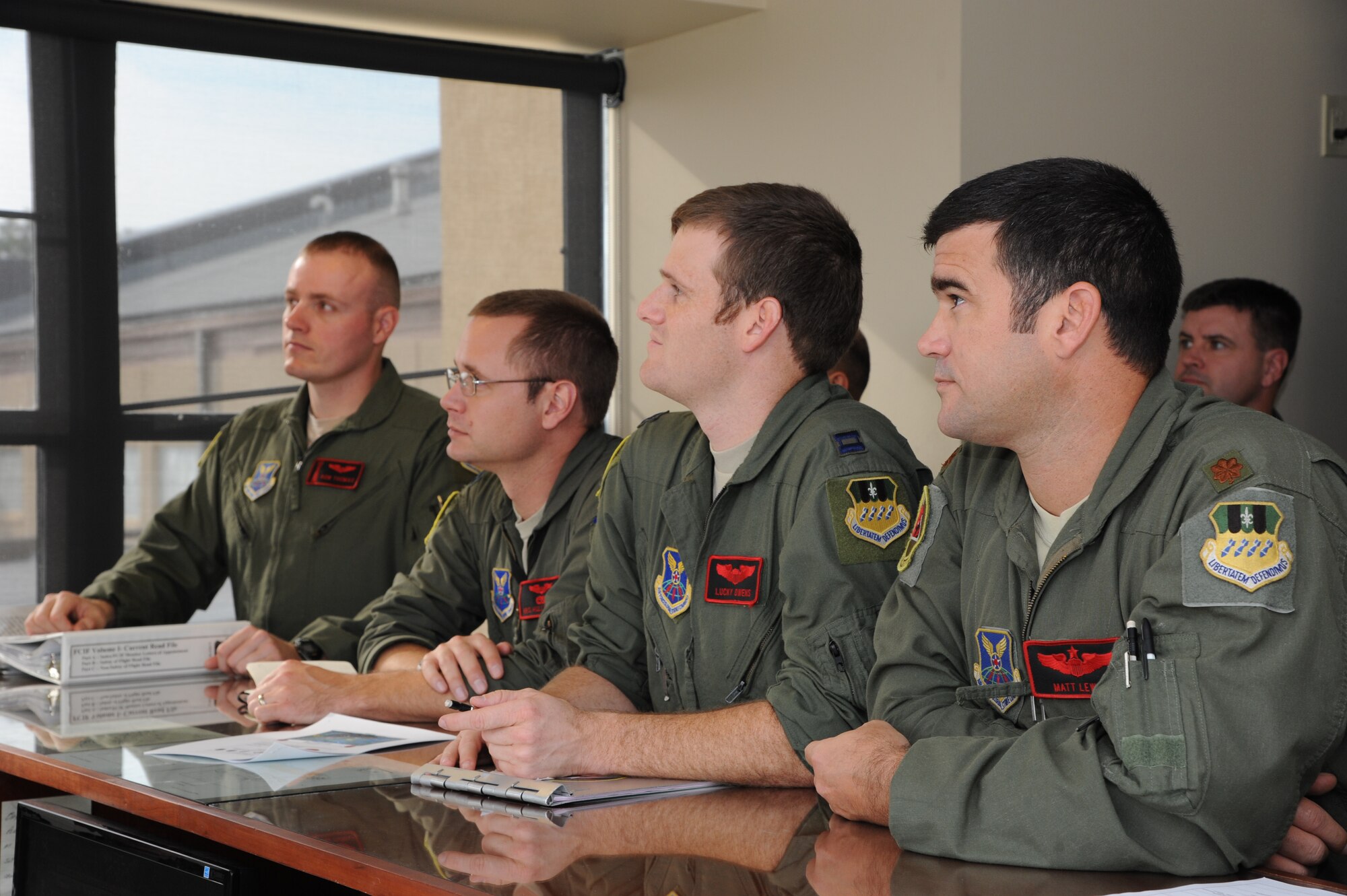 Aircrew members are briefed on flight details on Barksdale Air Force Base, La., Oct. 29, 2013. Briefings are held before every flight to inform aircrew on weather conditions and other important information to ensure a safe flight. (U.S. Air Force photo/Senior Airman Joseph A. Pagán Jr.)