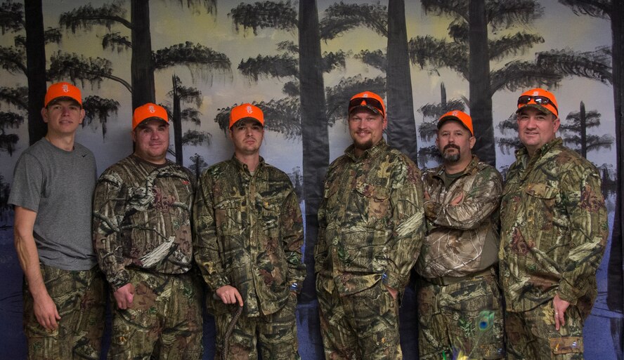 Six wounded Explosive Ordnance Disposal  technicians pose for a photo on Barksdale Air Force Base, La., Nov. 2, 2013. The six men were invited to the Barksdale Wounded Warrior Hunt, put together for the second year by Bill Lee, Barksdale Wounded Warrior Association event coordinator, and his team. The men are from several military branches and were all wounded while deployed. (U.S. Air Force photo/Staff Sgt. Amber Corcoran)