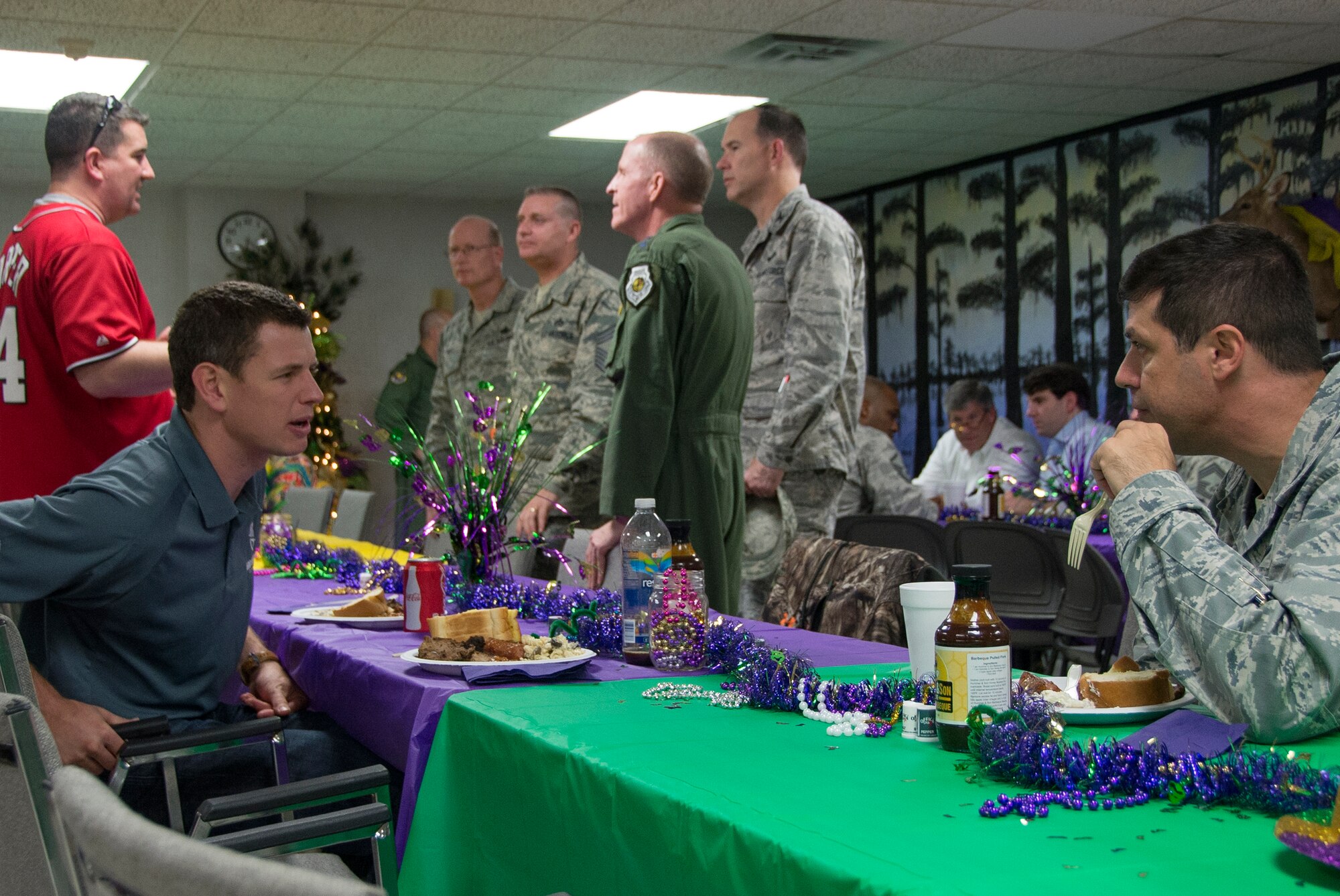 Col. Andrew Gebara, front right, speaks with retired Tech. Sgt. Adam Popp, Explosive Ordnance Disposal technician, front left, during a banquet on Barksdale Air Force Base, La., Nov. 1, 2013. Popp is also the director of the EOD Warrior Foundation. Base leadership and community members welcomed six wounded EOD technicians to Barksdale prior to the start of the weekend’s Barksdale Wounded Warrior Hunt. (U.S. Air Force photo/Staff Sgt. Amber Corcoran)