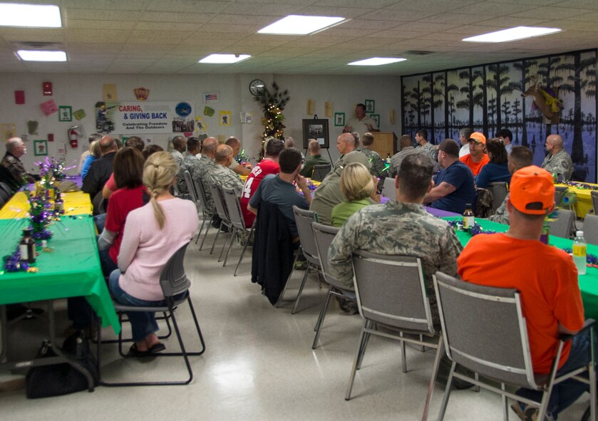 Bill Lee, Barksdale Wounded Warrior Association event coordinator, speaks to Shreveport/Bossier community members, Team Barksdale members and leadership, and wounded warriors prior to a banquet on Barksdale Air Force Base, La., Nov. 1, 2013. This is the second year Lee, and his team, have coordinated a deer hunt for wounded warrior participants on base. (U.S. Air Force photo/Staff Sgt. Amber Corcoran)