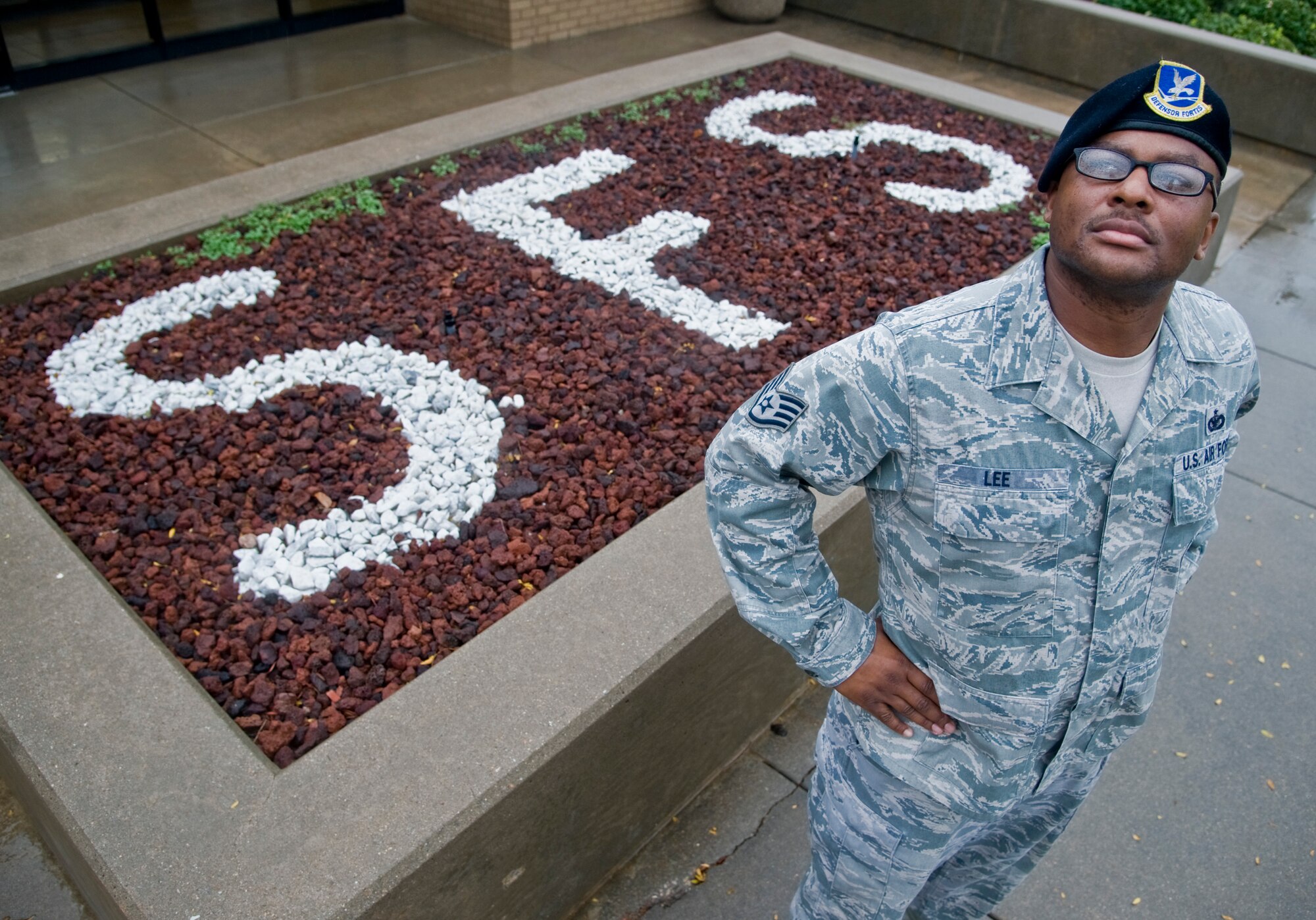 Staff Sgt. Jamey Lee, 22nd Security Forces Squadron defense biometric identification system program manager, poses in front of the 22nd SFS building, Nov. 5, 2013, at McConnell Air Force Base, Kan. He was selected as the 22nd ARW spotlight performer for the week of Nov. 1 to 8. He helps troubleshoot, setup and maintain installation access security systems.  (U.S. Air Force portrait/Airman 1st Class John Linzmeier)