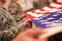 Minot Air Force Base Honor Guardsmen practice flag folding, Nov. 6, 2013. The Airmen of Minot AFB’s Honor Guard come together once a week to practice perfecting their ceremonial drills. (U.S. Air Force photo/Airman 1st Class Apryl Hall)