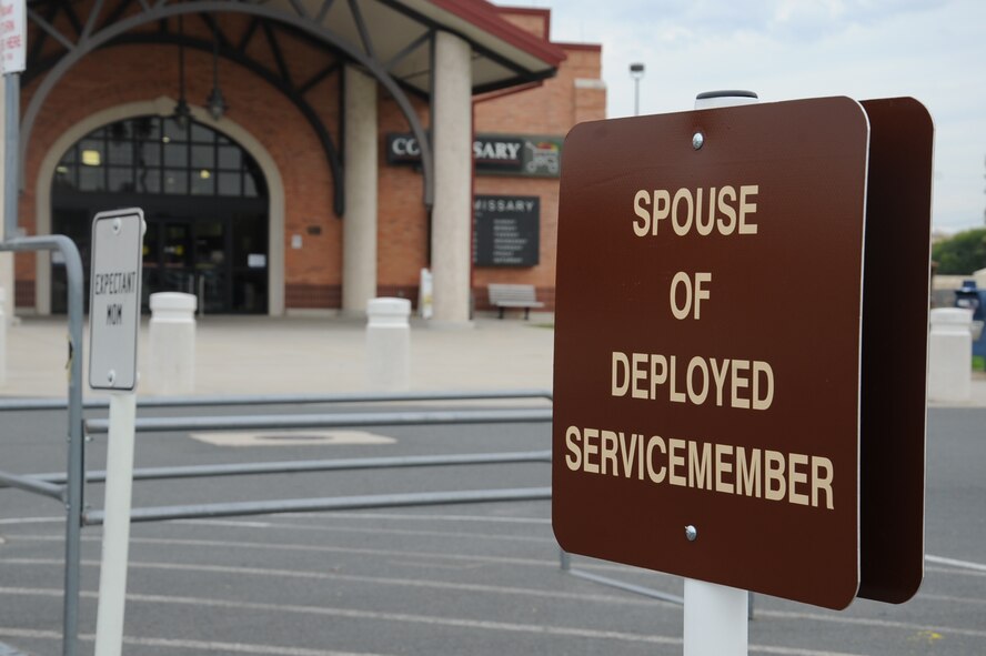 One of two recently installed signs at the Barksdale Commissary reserves a parking space for the spouses of deployed servicemen and women on Barksdale Air Force Base, Nov. 4, 2013. The space is one of several ways base leadership shows support to the families of its deployed Airmen. (U.S. Air Force photo/Senior Airman Sean Martin)
