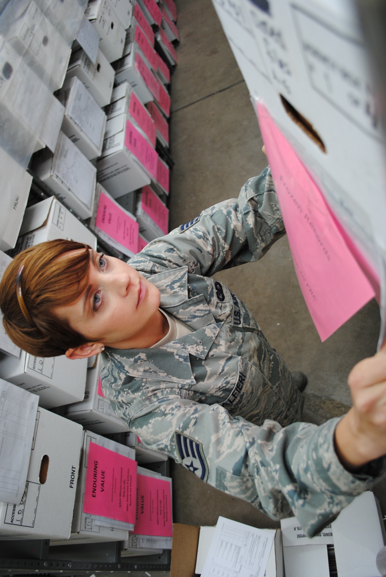 Staff Sgt. Sherry Alfieri, 319th Communications Squadron base records manager, organizes another box of files May 31, 2013, on Grand Forks Air Force Base, N.D. More than 5,000 pounds of boxed files are stored by the base records manager until their shelf life expires, at which point they are destroyed by incineration. (U.S. Air Force photo/Staff Sgt. Luis Loza Gutierrez)
