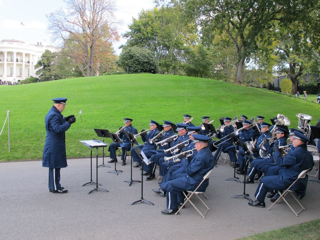 The Ceremonial Brass, conducted by Capt. Dave Alpar, performs at the Fall
White House Garden Tour. (A.F. photo by Technical Sgt. Josh Cullum)
