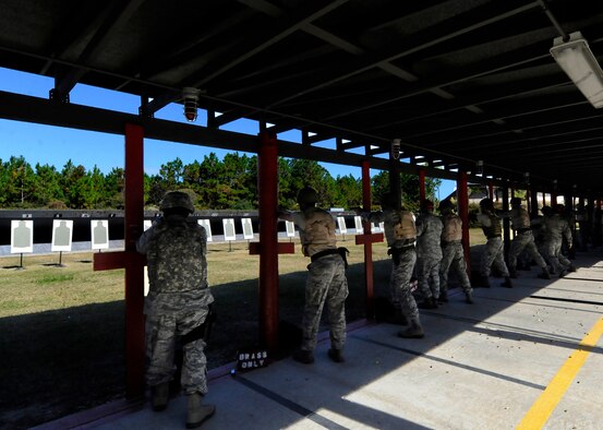 Students fire M9 pistols at their target on Hurlburt Field, Fla., Nov. 5, 2013. The training is conducted to meet various requirements such as deployment readiness, annual certification, permanent changes in station, proficiency, and sustainment shooting. (U.S. Air Force photo/Staff Sgt. Jeff Andrejcik)