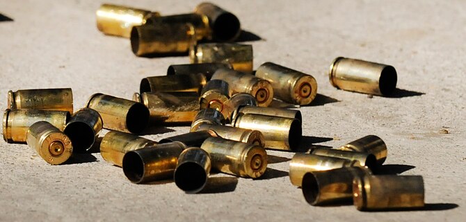 Shell casings from an M9 pistol lie on the ground at Hurlburt Field, Fla., Nov. 5, 2013, during weapons qualification training. The training is completed regularly to meet various requirements such as deployment readiness, annual certification, permanent changes in station, proficiency, and sustainment shooting. (U.S. Air Force photo/Staff Sgt. Jeff Andrejcik) 
