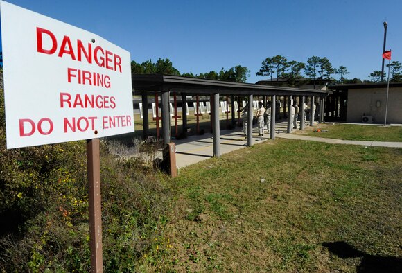 Students prepare to fire M9 pistols at Hulburt Field, Fla., Nov. 5, 2013. The training is accomplished regularly to meet various requirements like deployment readiness, annual certification, permanent changes in station, proficiency, and sustainment shooting. (U.S. Air Force photo/Staff Sgt. Jeff Andrejcik) 
