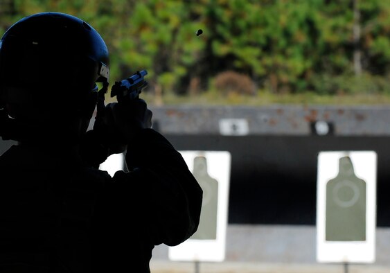 A student fires an M9 pistol at a target at Hulburt Field, Fla., Nov. 5, 2013. The training is conducted to meet various requirements such as deployment readiness, annual certification, permanent changes in station, proficiency, and sustainment shooting. Hurlburt Field’s firing range qualifies about 10,000 people every year. (U.S. Air Force photo/Staff Sgt. Jeff Andrejcik)