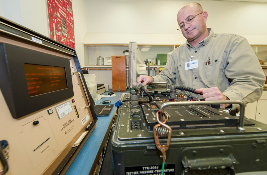 Larry Loe, a 92nd Maintenance Squadron Precision Measurement Equipment Laboratory physical dimensions technician and Spokane, Wash., native, calibrates a TTU-205 Pressure-Temperature Test Set at Fairchild Air Force Base, Wash., Nov. 5, 2013. The TTU-205 is a rugged, self-contained flight line or hangar test system used to accurately simulate in flight pressure conditions by precisely controlling and measuring altitude and airspeed pressure to aircraft’s pitot-static system. (U.S. Air Force photo by Staff Sgt. Benjamin W. Stratton/Released)