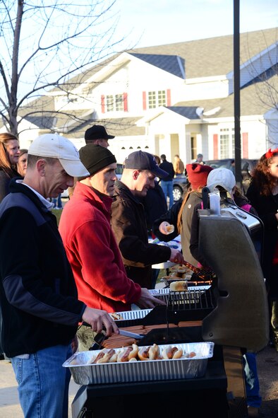 (From right to left) Col. Robert Stanley, 341st Missile Wing commander, Col. David Lair, 341st Maintenance Group commander, and Chad Deranger, spouse of Col. Marné Deranger, 341st Missile Wing vice commander, cook hot dogs for hungry trick-or-treaters during the commanders’ Halloween party Oct. 31. In total, more than 500 people attended the event. (U.S. Air Force photo/Airman 1st Class Collin Schmidt)