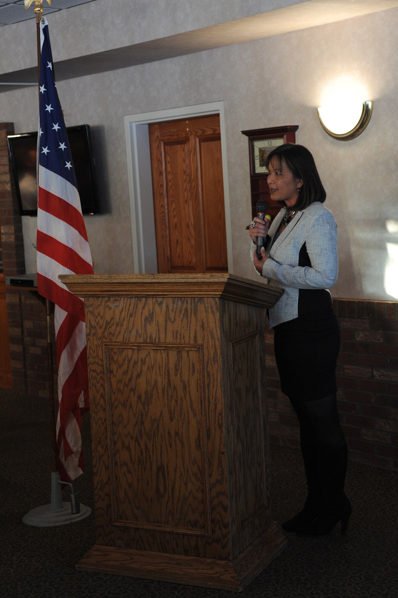 Joann Gogo, Great Falls Chamber of Commerce member, welcomes people attending the Great Falls Great Friends program kickoff Oct. 30.  The program matches members of the community with Airmen.  (U.S. Air Force photo/Senior Airman Cortney Paxton)