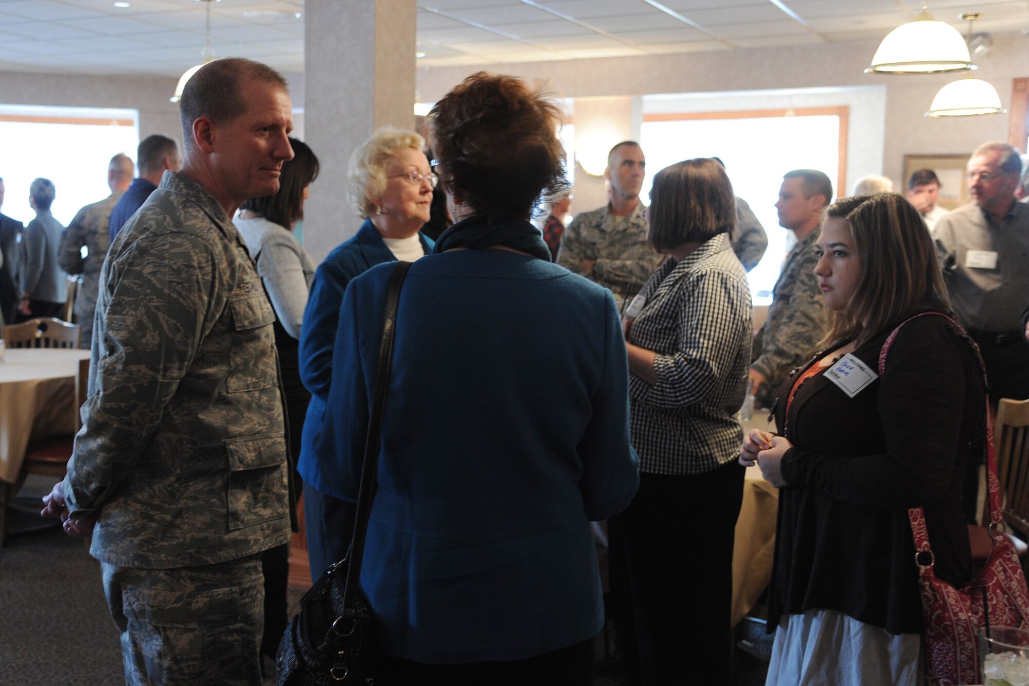 Col. Robert Stanley, 341st Missile Wing commander (left), speaks to Great Falls Chamber of Commerce members during the Great Falls Great Friends program kickoff Oct. 30.  The kickoff included a social hour, hors d’oeuvres, drinks and comments by Joann Gogo, Chamber member; Stanley and Lori Muzanna, 341st Missile Wing community support coordinator.  (U.S. Air Force photo/Senior Airman Cortney Paxton)