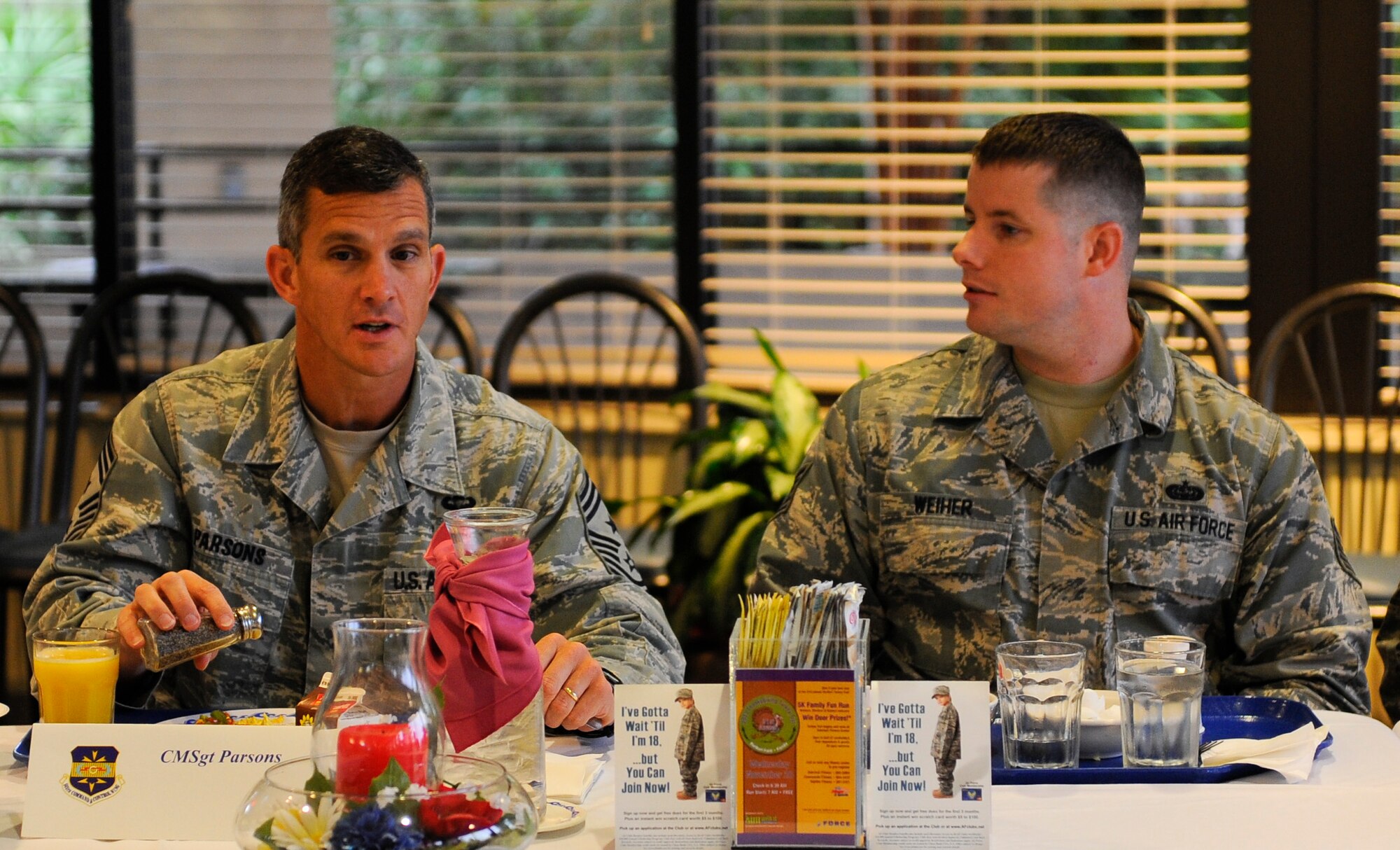 Chief Master Sgt. Richard Parsons, Air Combat Command command chief, left, and Tech. Sgt. Cory Weiher, 823rd RED HORSE Squadron knowledge operations section chief, eat breakfast at the Riptide Dining Facility on Hurlburt Field, Fla., Nov. 6, 2013. Several other ACC Airmen stationed here and at Eglin Air Force Base, Fla., joined Parsons for breakfast. (U.S. Air Force photo/Airman 1st Class Jeff Parkinson)