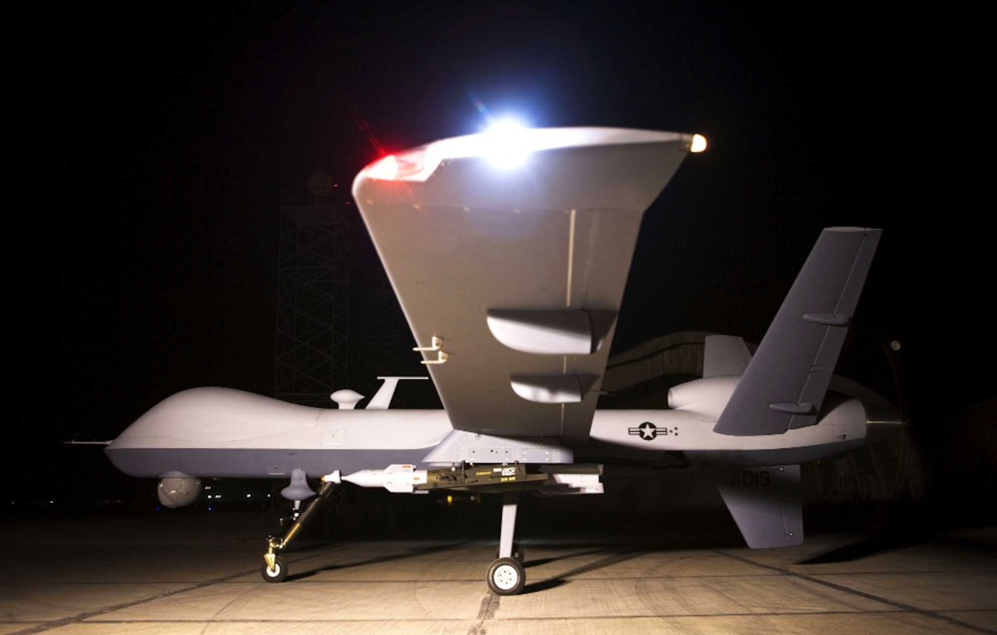 An MQ-9 Reaper remotely piloted aircraft sits on a ramp.  The Reaper is an armed, multi-mission, medium-altitude, long-endurance remotely piloted aircraft that is employed primarily as an intelligence-collection asset and secondarily against dynamic execution targets.  (Photo courtesy of U.S. Air Force)