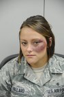 Airman 1st Class Kaitlyn Mallard, 359th Medical Group family health care administrator, shows what her face looks like after receiving faux bruising during Joint Base San Antonio-Randolph’s first Black Eye Project Oct. 25 at the JBSA-Randolph mental health clinic. Part of the JBSA Domestic Violence Awareness Month activities, the social experiment consisted of several participants with simulated injuries in order to gauge the community’s reaction to signs of at-home violence. (U.S. Air Force photo by Airman 1st Class Alexandria Slade)