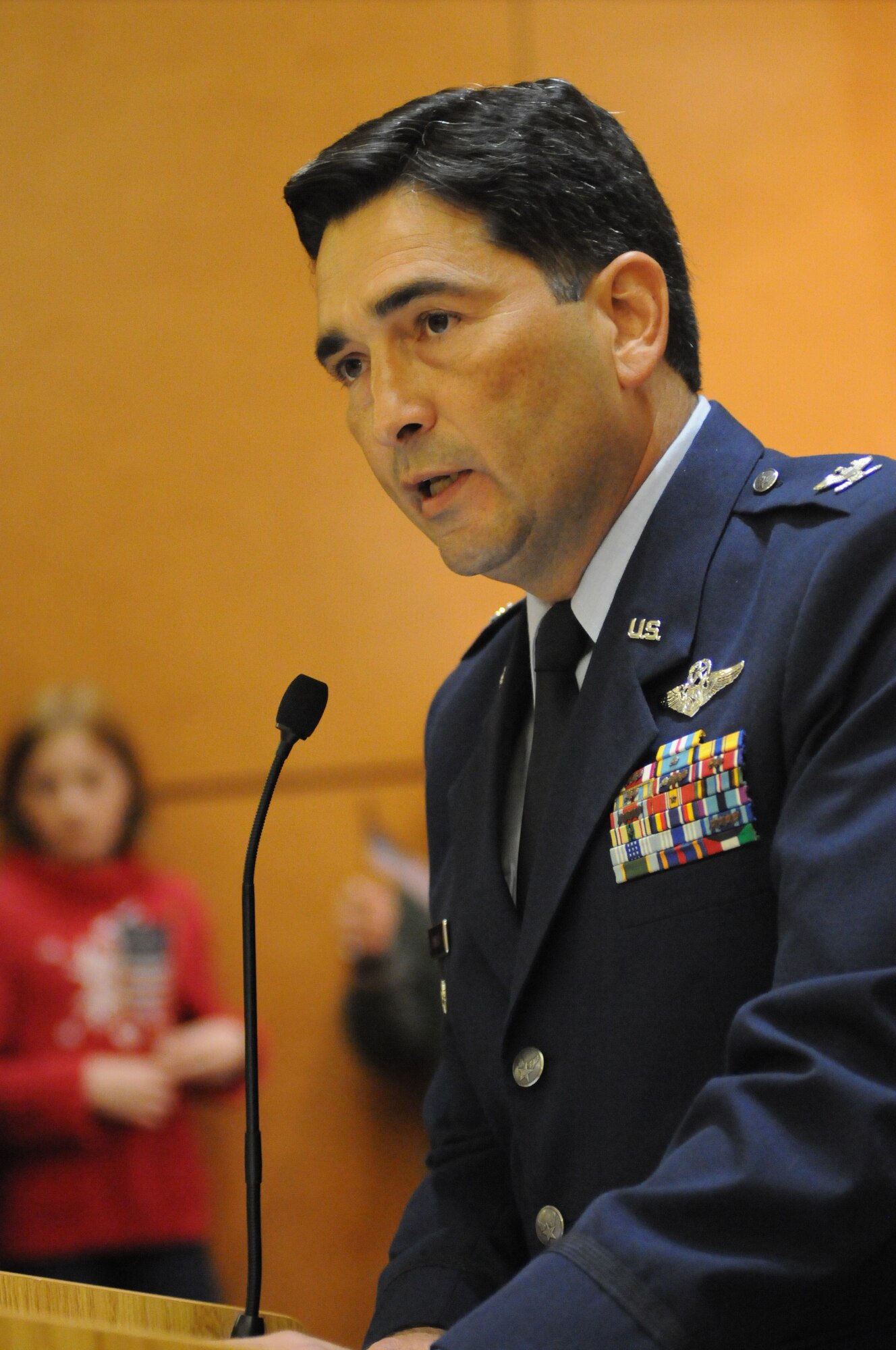 Col. Rene Romero, 81st Training Wing vice commander, speaks to family, friends and supporters prior to the arrival of the final Mississippi Gulf Coast Honor Flight at the Gulfport/Biloxi International Airport from Washington, D.C., Nov. 5, 2013. The Honor Flight is a nonprofit program that sends veterans to Washington, D.C., to see national monuments. Throughout the three years of the honor flight program, 592 veterans have participated.  (U.S. Air Force photo by Kemberly Groue)