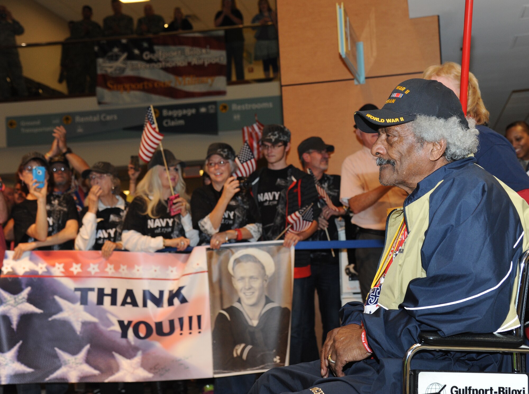 George Hammett, U.S. Army World War II veteran, arrives at the Gulfport/Biloxi International Airport with the final Mississippi Gulf Coast Honor Flight from Washington, D.C., Nov. 5, 2013. The Honor Flight is a nonprofit program that sends veterans to Washington, D.C., to see national monuments. Throughout the three years of the honor flight program, 592 veterans have participated.  (U.S. Air Force photo by Kemberly Groue)