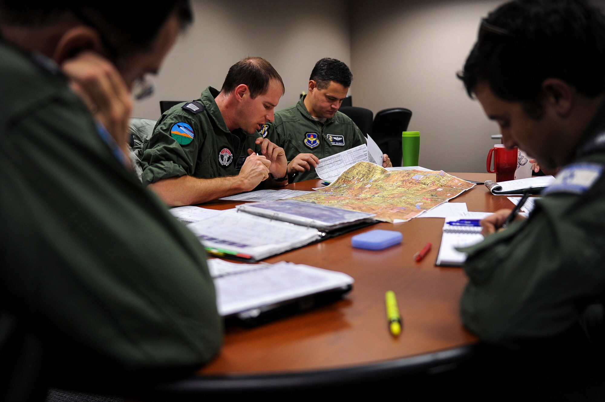 The pilots and navigator from the Israeli Air Force plan their morning’s flight with their instructors from the 314th Airlift Wing Oct. 28, 2013, at Little Rock Air Force Base, Ark. The Israeli students were preparing to take their recommendation flight, designed to test their proficiency in operating the C-130J before they’re cleared to fly. (U.S. Air Force photo by Airman 1st Class Cliffton Dolezal)