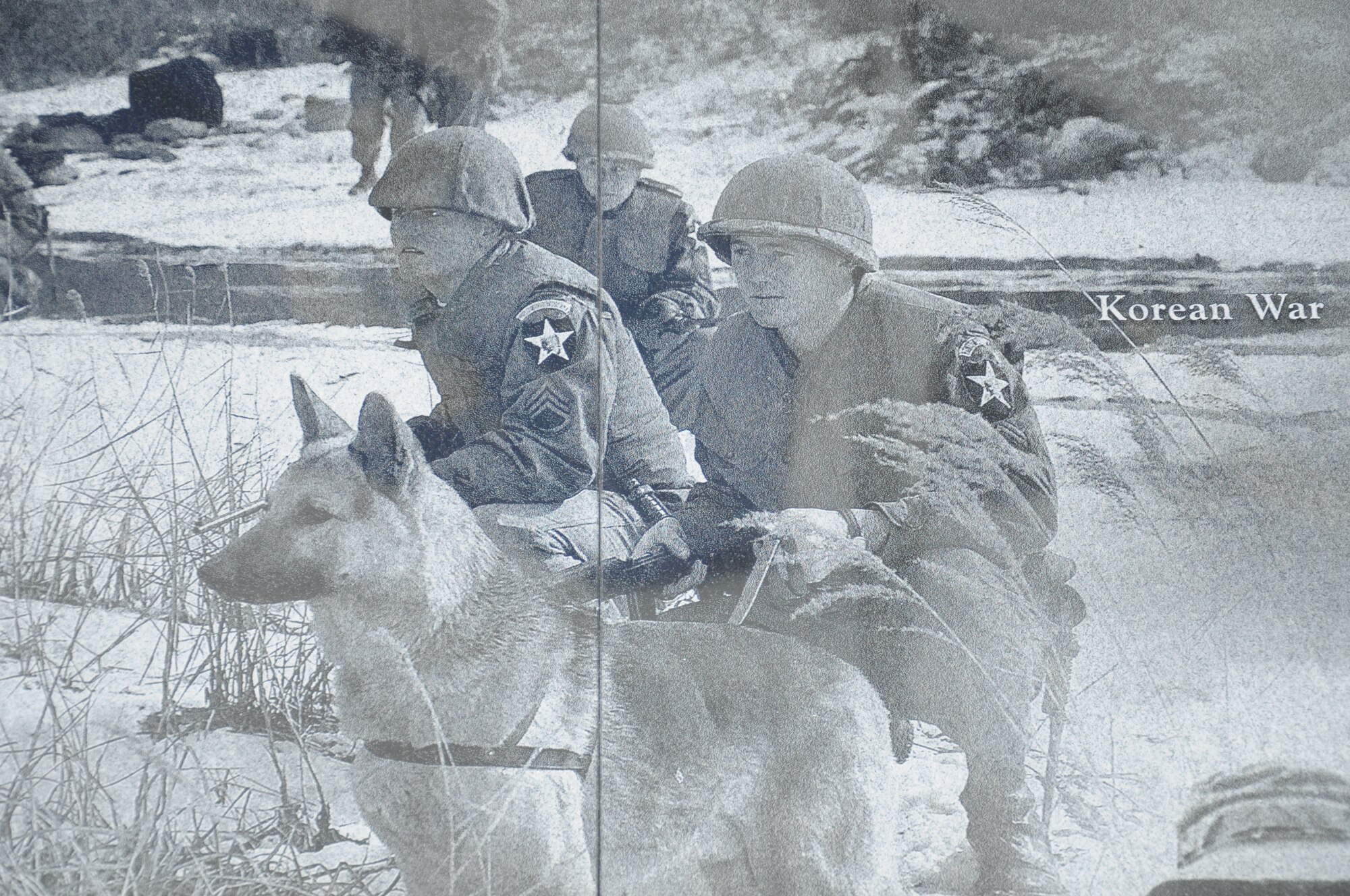 A image taken in the Korean War of a military team with a canine was part of a collection that create a montage that is etched onto the face of the Military Working Dog Teams’ National Monument which was revealed Oct. 28, 2013 at Joint Base San Antonio-Lackland, Texas. The Department of Defense Military Working Dog Program is located at JBSA-Lackland where teams have been trained since 1958. (U.S. Air Force photo by Airman 1st Class Krystal M. Jeffers/Released)